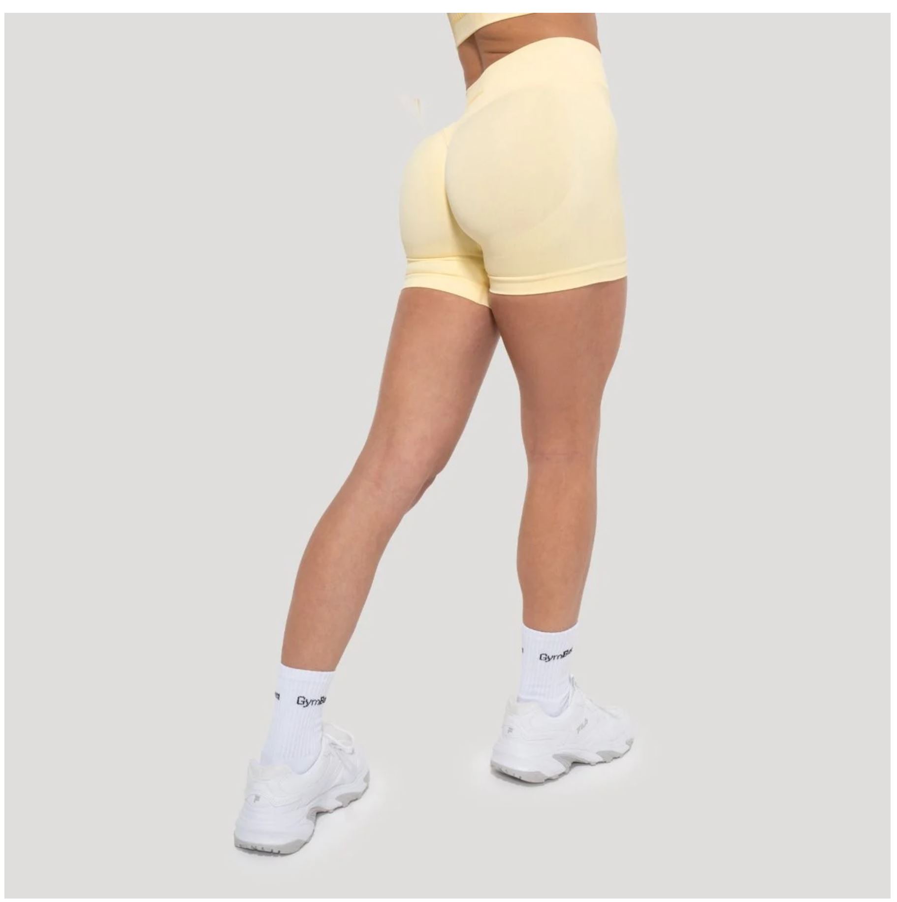 GymBeam LUMA Shorts Sportshorts für Frauen nahtloses Design Scrunchshorts Gelb Gr. S